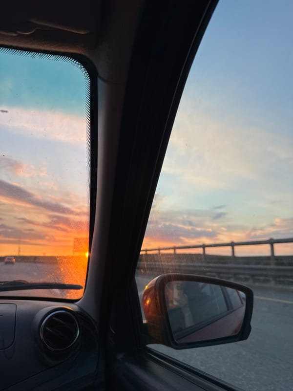 Vehicle passenger captures serene dawn or dusk in Perm