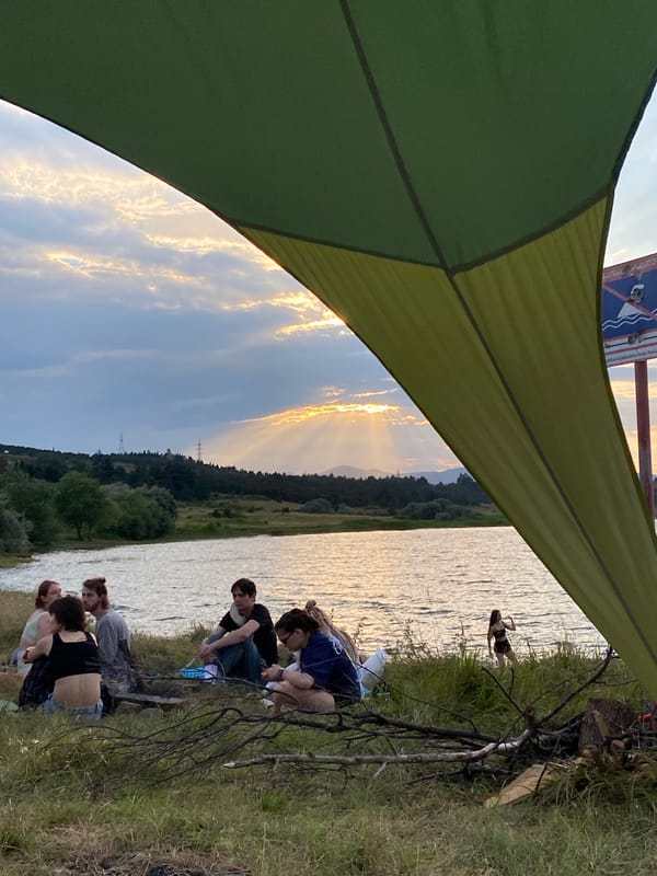 Picnic by the water in Tbilisi, stormy skies and pizza
