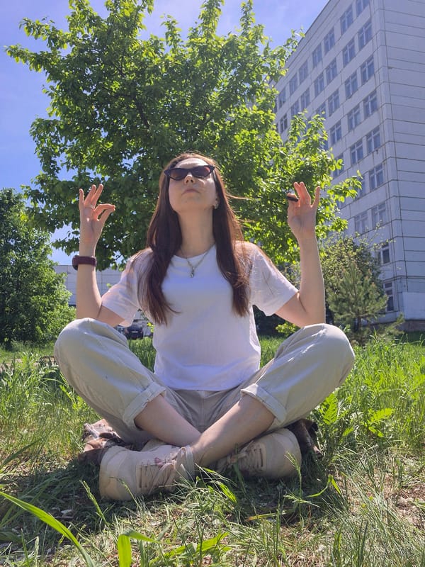 Woman enjoys morning yoga session in urban park setting