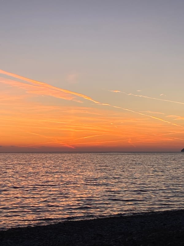 Young man walks waterfront paths during sunset in Bar, Montenegro