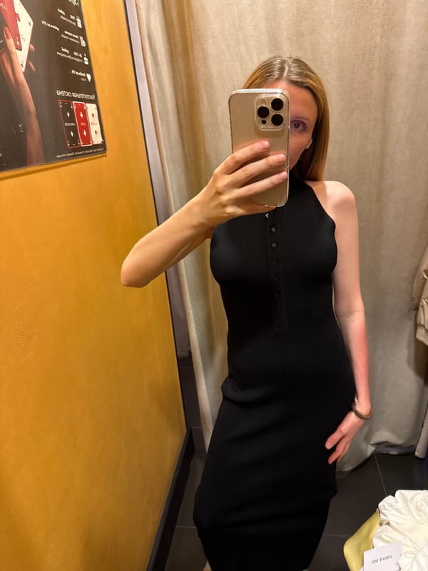 Fitting room try-on session with mirror selfies and outfit changes