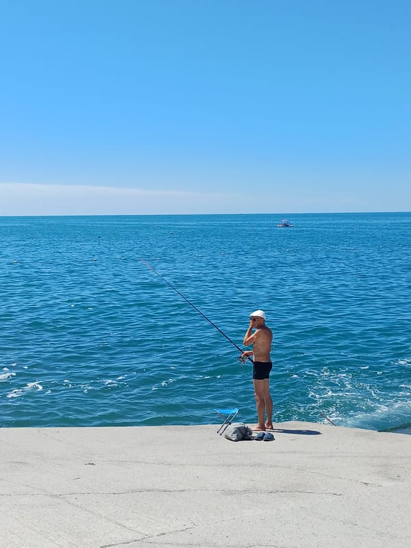 Sochi's Black Sea beach packed on a sunny summer morning
