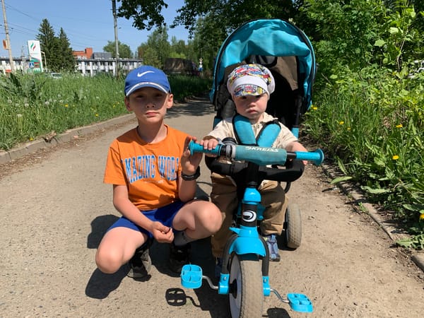 Children play on path in Izhevsk during morning hours