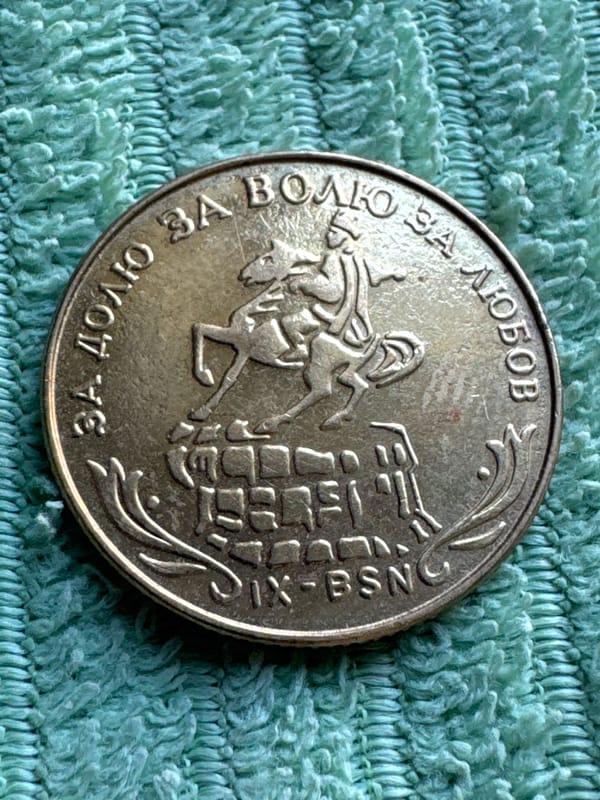 Ukrainian collector photographs coins and vintage currency in Kyiv