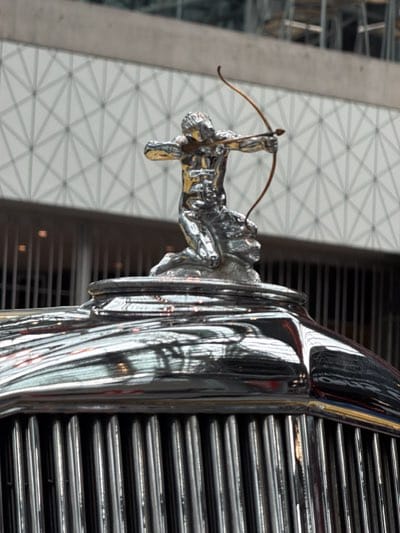 Vintage car's archer hood ornament photographed at Brookfield Place