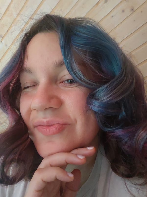 Woman takes colorful-haired selfies in Russian village