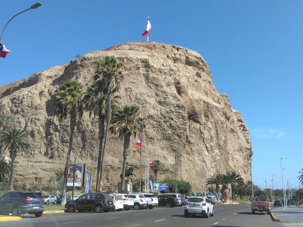 Exploring Arica's coastal streets and landmarks on sunny afternoon