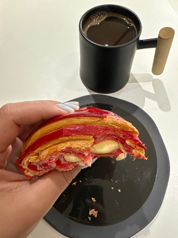 Morning pastry consumption documented in Tbilisi breakfast setting