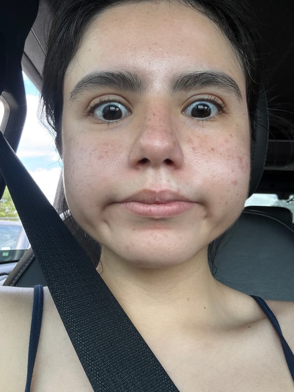 Young woman photographed driving near South Congress Avenue, Austin