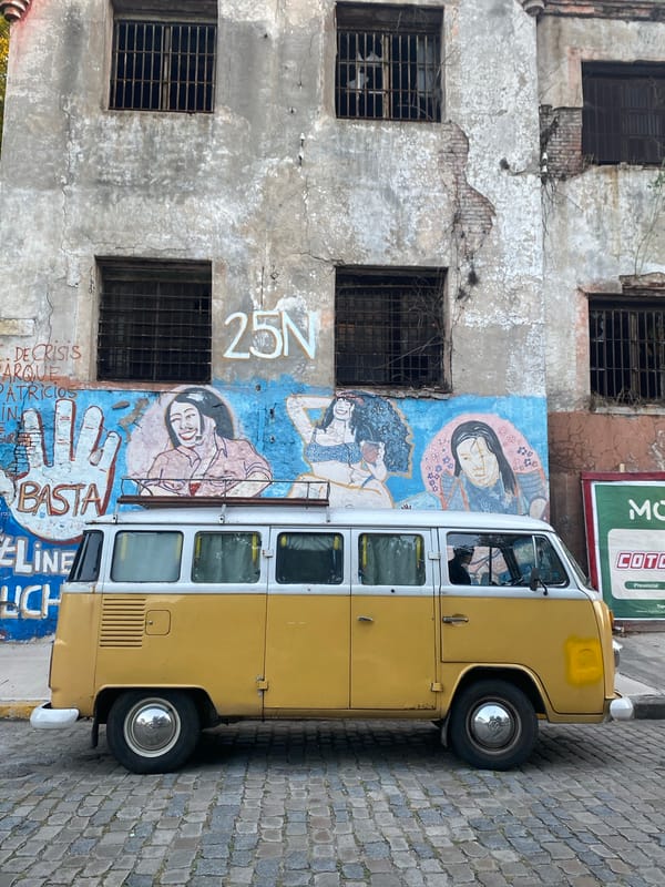Volkswagen van parked near decaying building in Buenos Aires