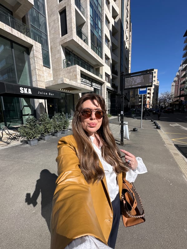 Woman applies lip balm in T'bilisi bathroom Tuesday morning