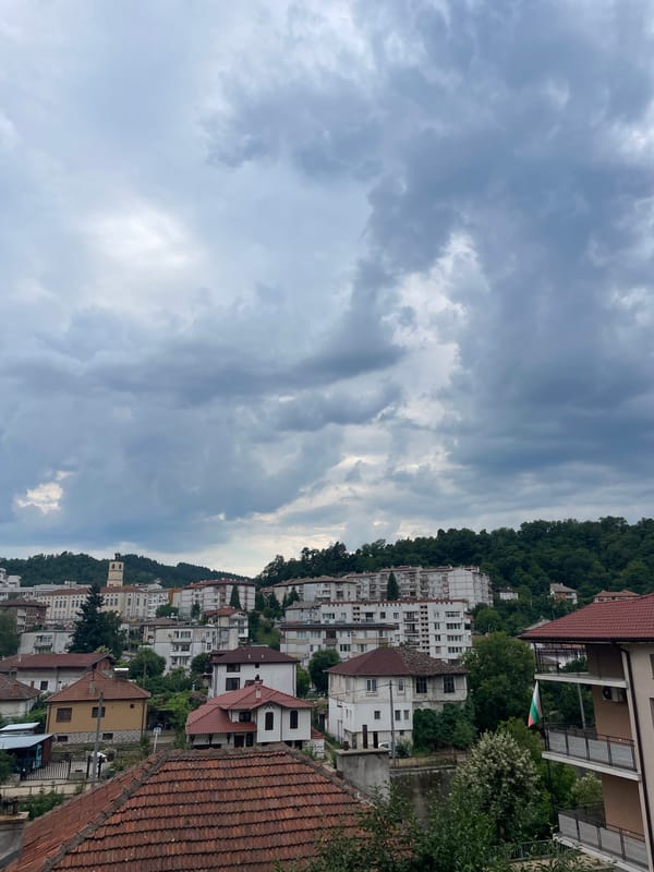 Zlatograd hillside town under brooding summer skies