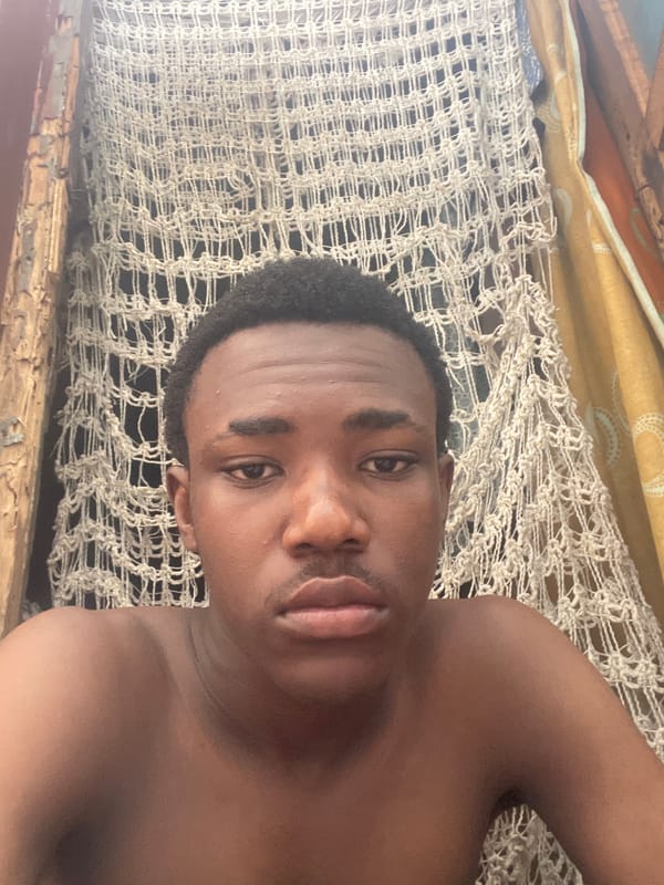 Man rests indoors during afternoon in Lagos residential area