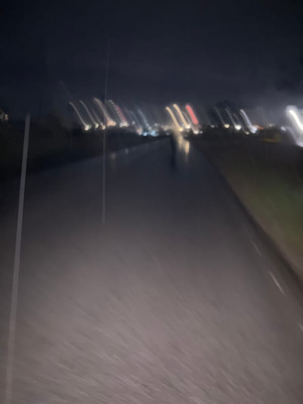 Blurred night lights captured from moving vehicle in Karlovo