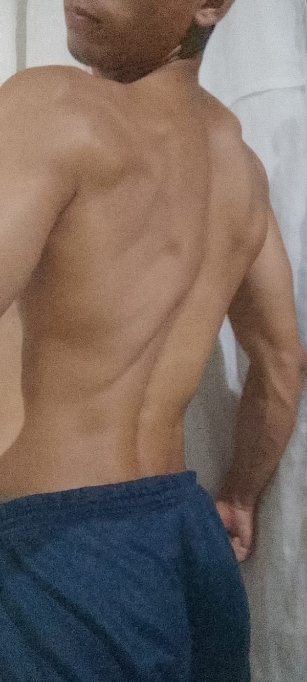 Man photographed posing indoors and outdoors in Juan Griego