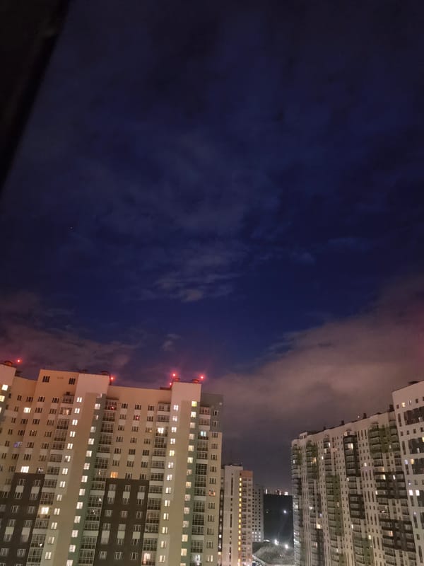 Dusk aerial views of a residential complex and rocket launch