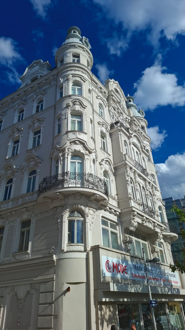 Ornate building facade photographed in Vienna under blue skies