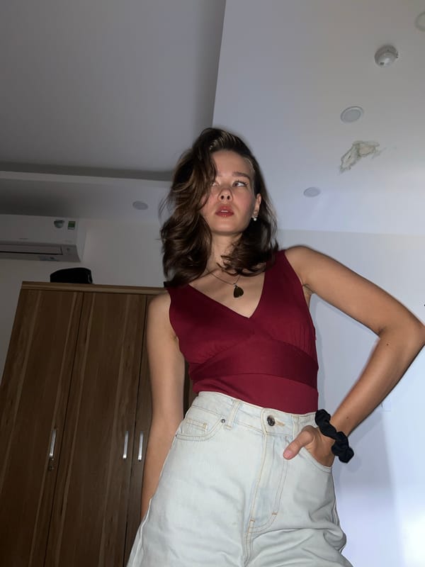 Woman poses indoors in Nha Trang apartment setting