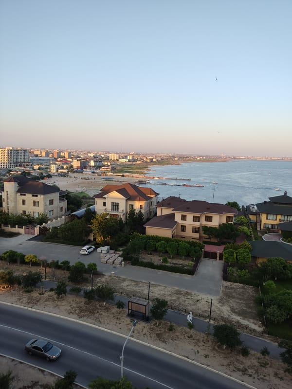 Aerial pass over coastal buildings and waterfront property