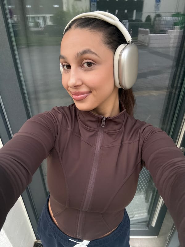 Woman takes selfie session in brown athletic wear, Mönchengladbach