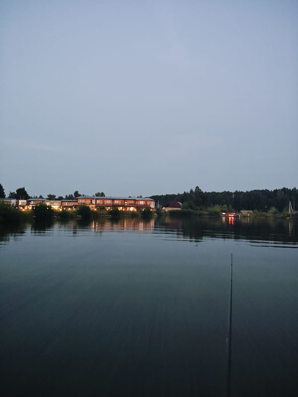 Modern lakeside resort glowing at dusk in Chaikovsky, Russia