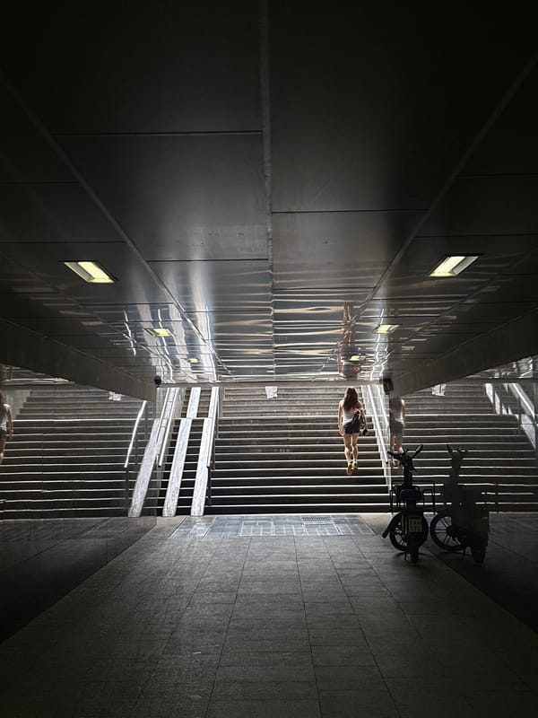 Urban alley scene captured showing light-shadow contrasts between buildings