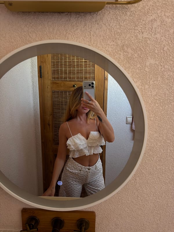 Woman takes mirror selfies in Mengwi, Indonesia