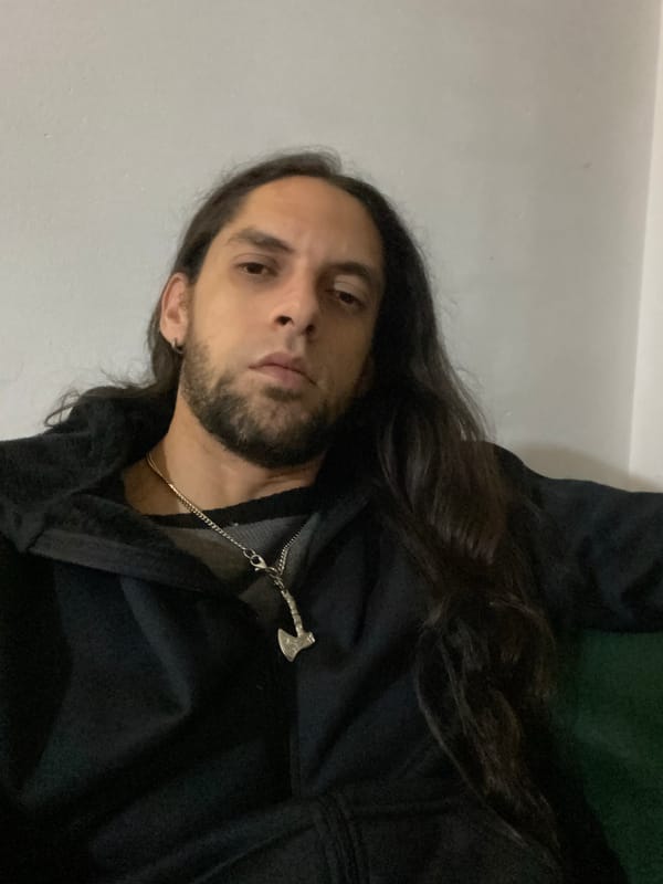 Person in hooded sweatshirt observed indoors in Wilde, Argentina