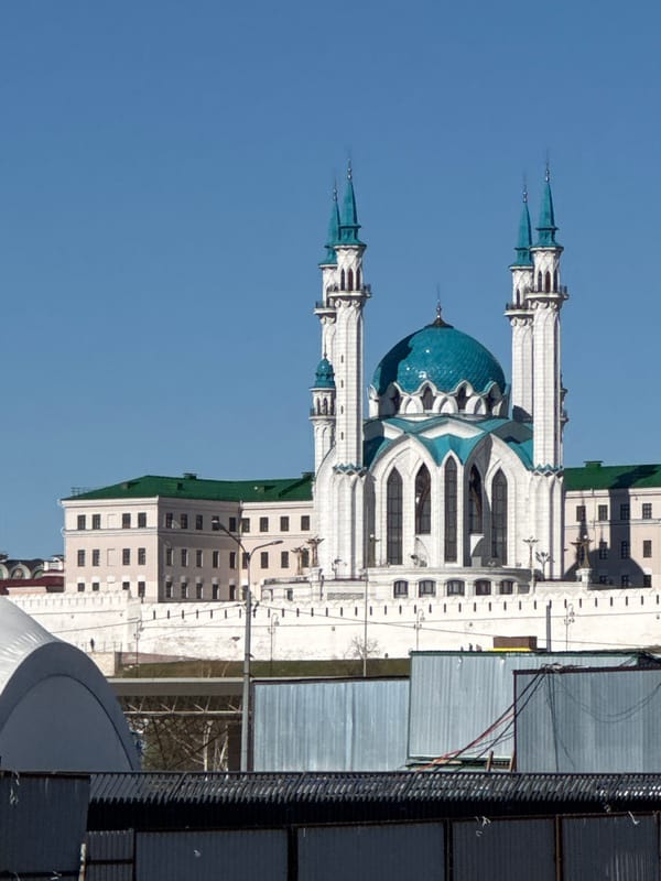 Man documents construction site visit near Kazan's historic mosque