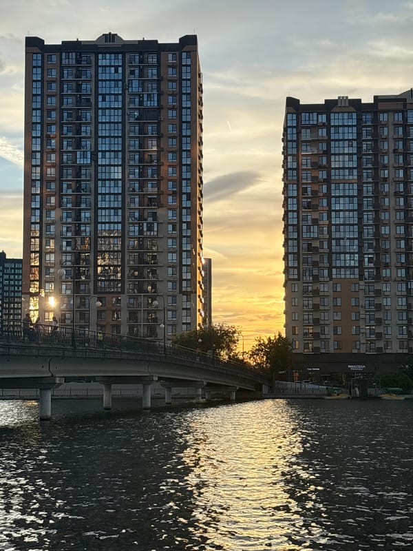 Astrakhan riverfront at golden hour: wakeboarders, promenaders, summer city life