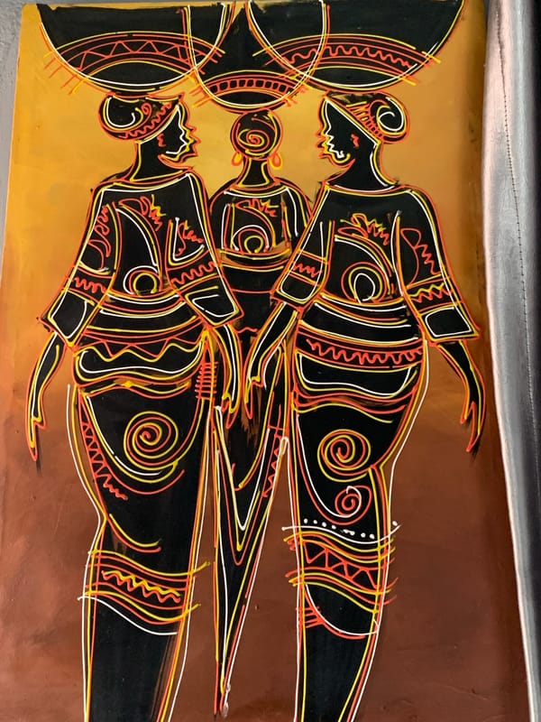 Abstract art piece with three stylized figures observed in Nigeria