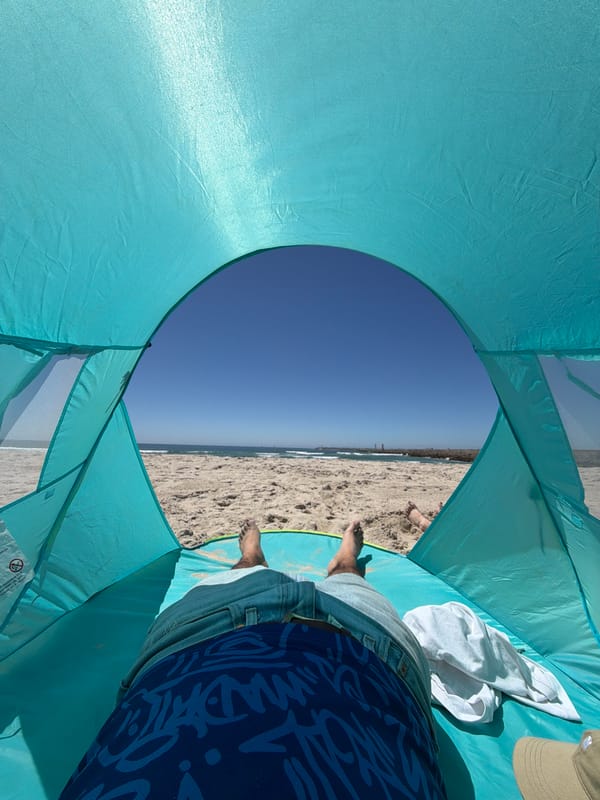 Beachgoer relaxes in tent at Gafanha da Nazaré