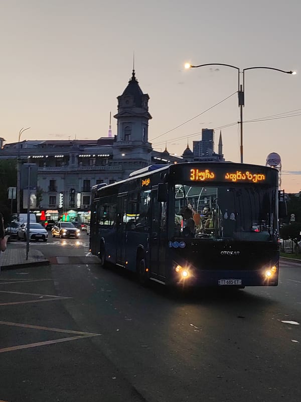 Batumi at dusk: buses, cable cars, and harbor views