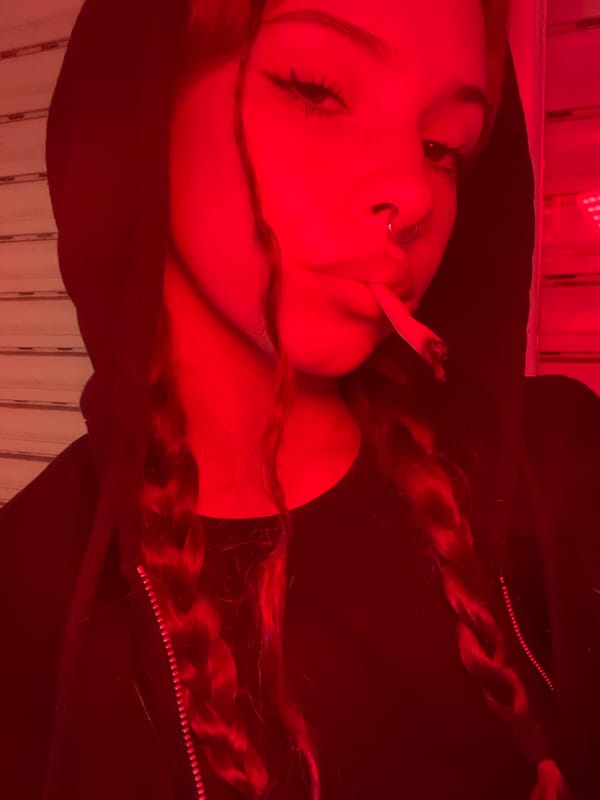 Woman spotted smoking cigarette while lying down in Buenos Aires