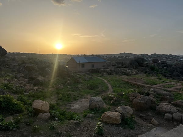 Sunset documented across Jos Nigeria's rocky landscape and neighborhoods