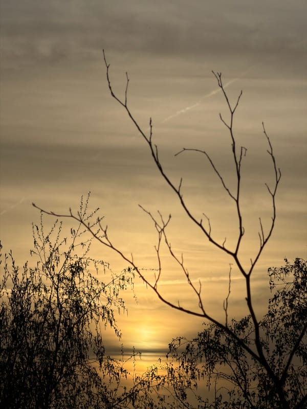Hazy sunset observed through clouds in Schifflange, Luxembourg