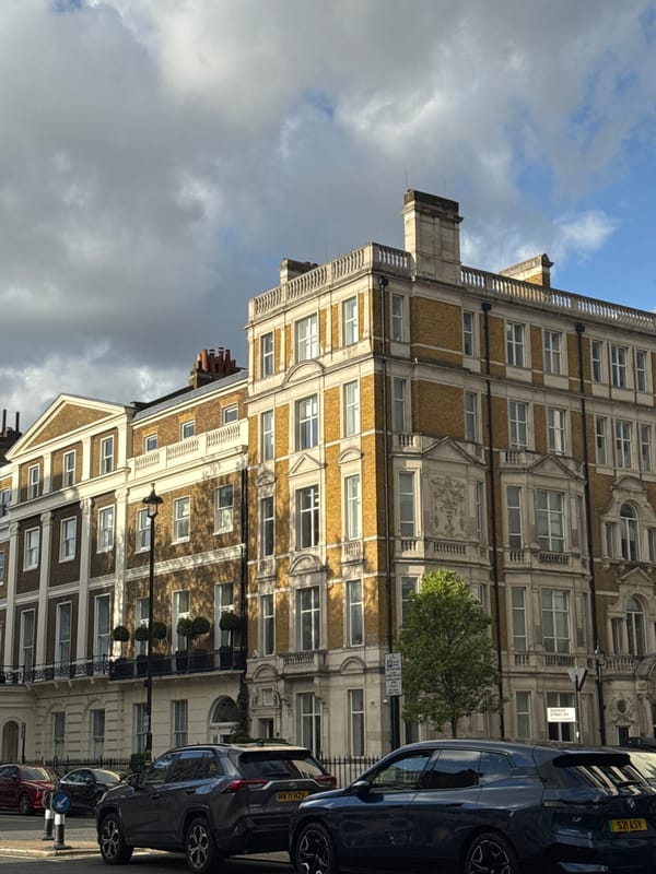 London street scene captured showing typical buildings under cloudy skies