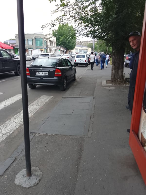 Morning street activity documented across Armenian city intersections