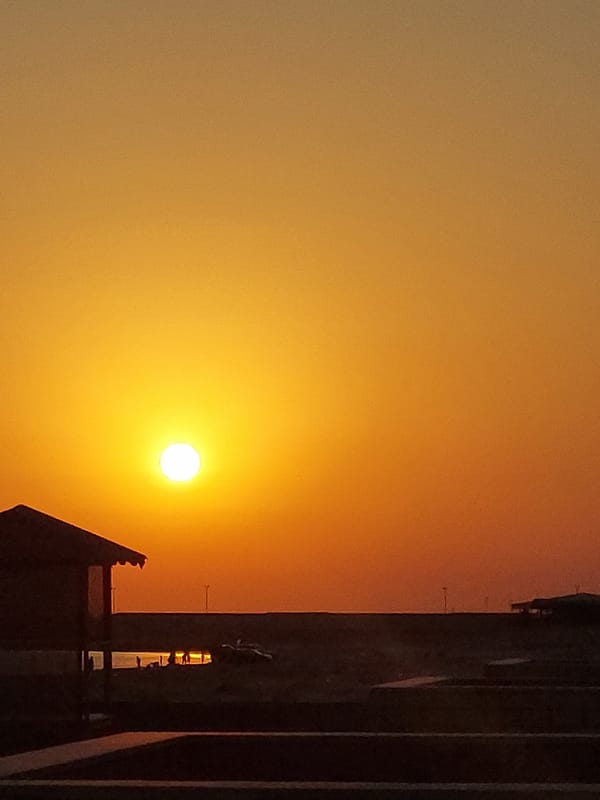 Caspian sunset at a Pirallahi beach spot with paddleboards