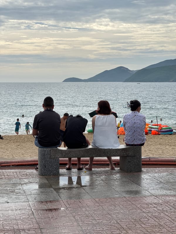 Busy morning along Nha Trang's beach and vendor-lined sidewalks