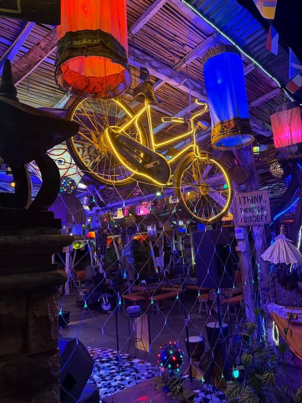 Bali nightlife strip: bars, kitchens, and neon-lit streets