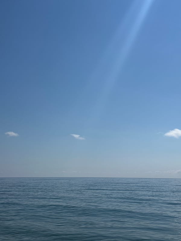 Clear morning sky and sea horizon captured at sea