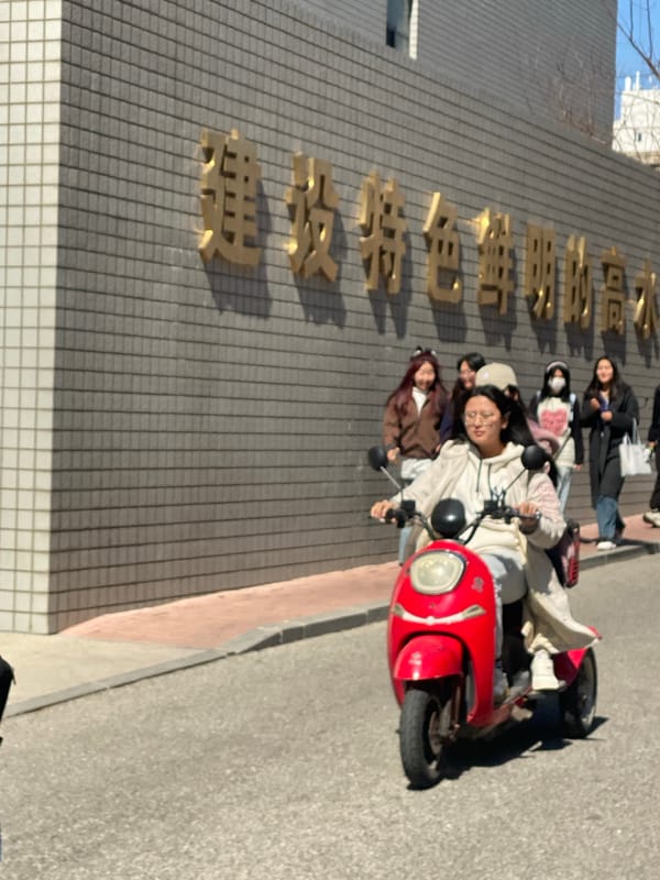 Pedestrians walk through sunny streets in Chinese cities