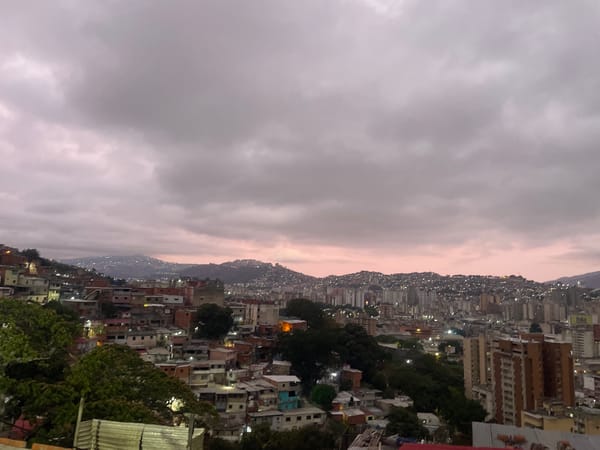 Caracas cityscape documented showing dense residential areas under clouds