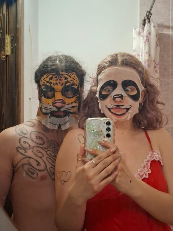 Tiger and panda face masks in a Donetsk bathroom selfie