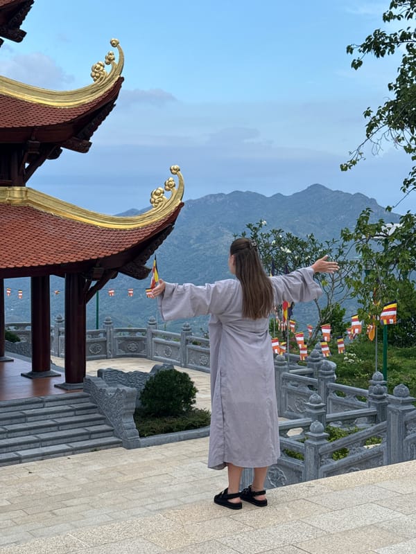 Woman performs ritual gesture at Vietnam temple