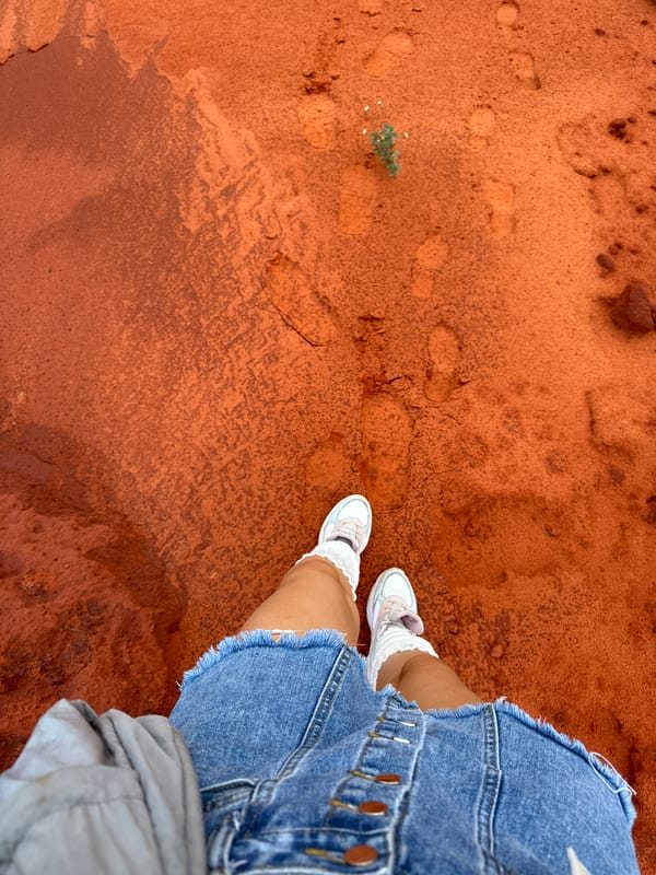 Tourists explore Mui Ne's red sand dunes and formations