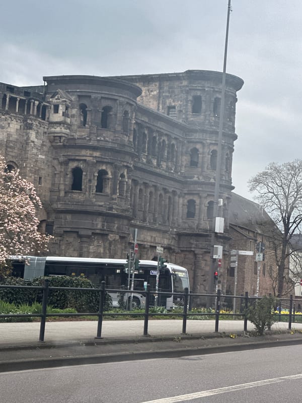 Spring afternoon street life documented at Trier's Porta Nigra