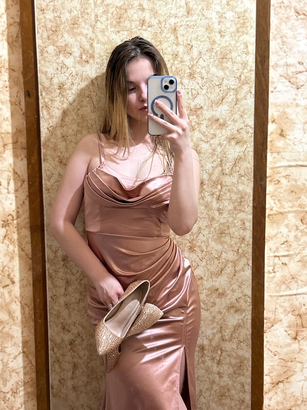 Woman takes mirror selfies with gold shoes in Plovdiv