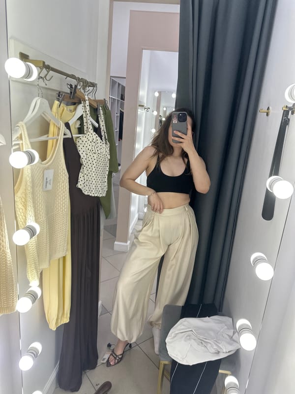 Woman takes fitting room selfie at Perm clothing store